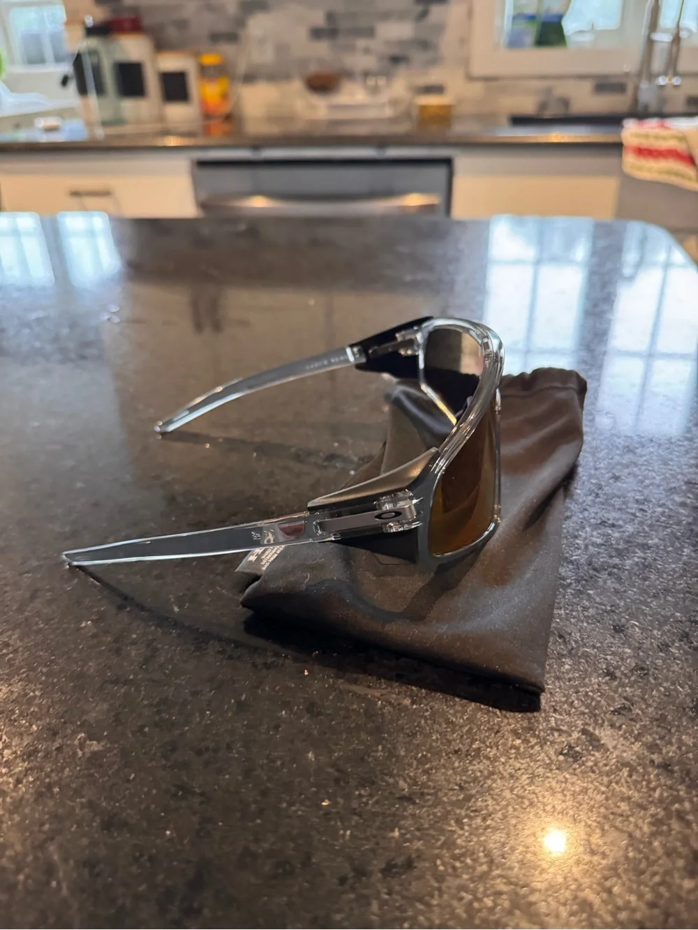 Oakley Shield Sunglasses with Red-Orange Mirrored Lens and Clear Frame